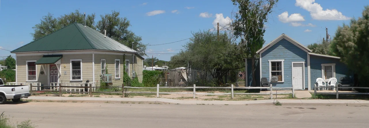 Houses at 201 (left=west) and 223 (right=west) E. 3rd Street in Benson, Arizona.  The houses are part of the Benson Railroad Historic District, listed in the National Register of Historic Places.